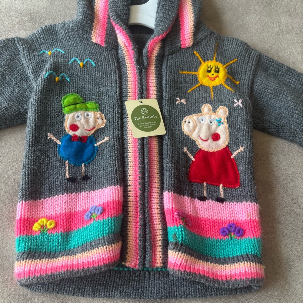 Toddler artisan made zip up sweater. New with tag